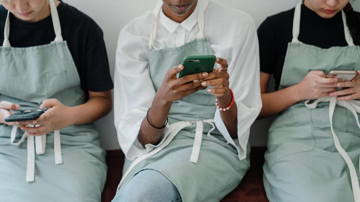 frontline workers with phones by ketut subiyanto via pexels