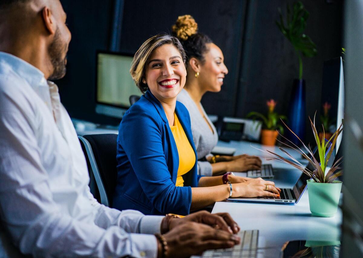 smiling happy workers by jopwell via pexels